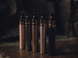 A colorful lineup of various Raz disposable vapes, showcasing the wide range of flavor options available