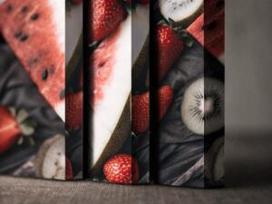 A close-up, artful shot of multiple fruits like strawberries, kiwis, and watermelons blending together.