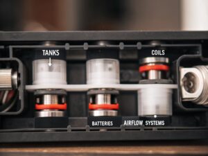 A detailed schematic or CAD drawing of a complex multi-tank vape device.